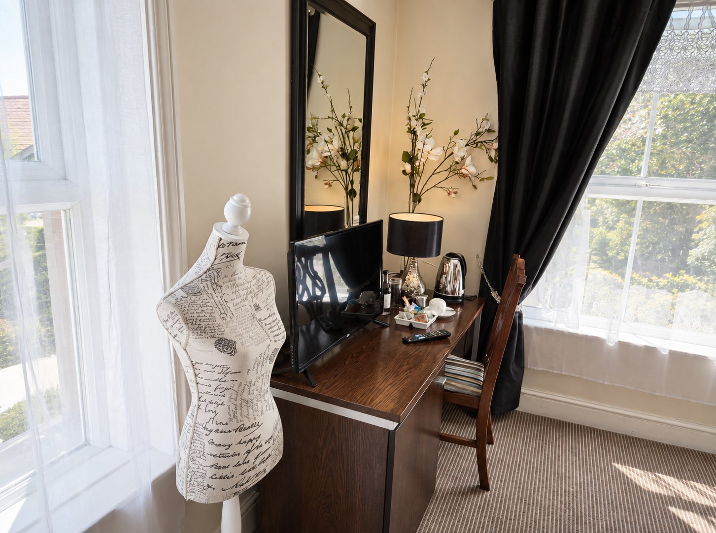 Dressing table and window in a guest bedroom at The Swan at Compton