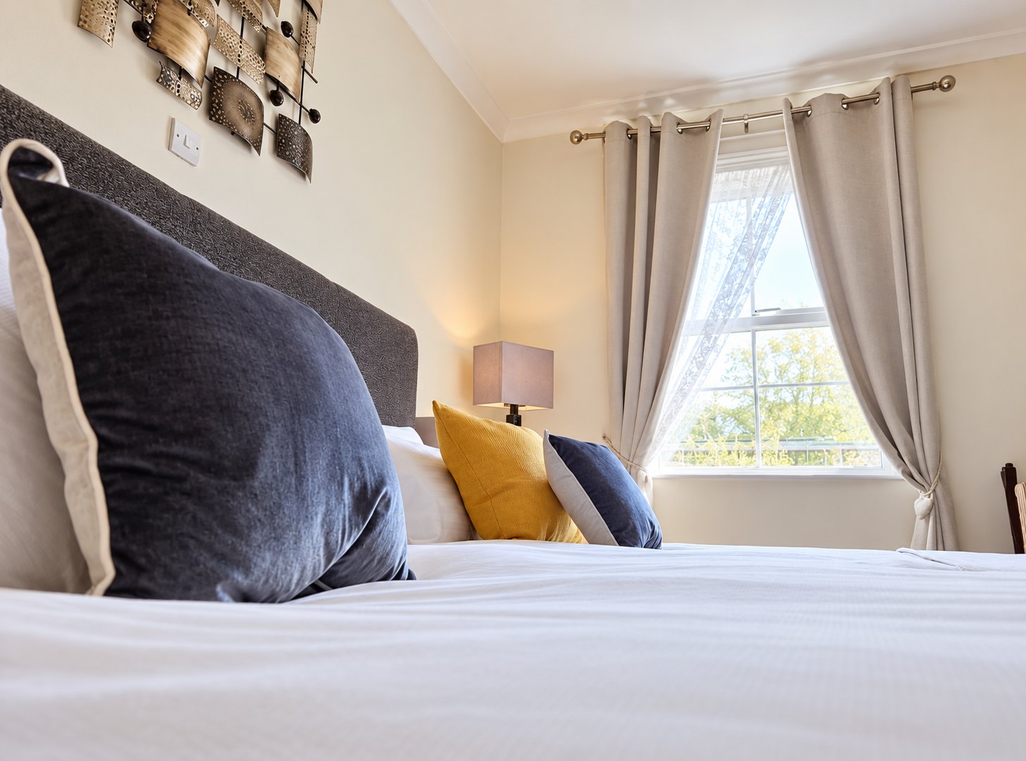 Bedside detail in a guest bedroom at The Swan at Compton